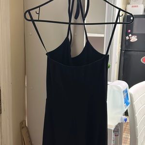 Black jumper suit small black long with straps around back of neck